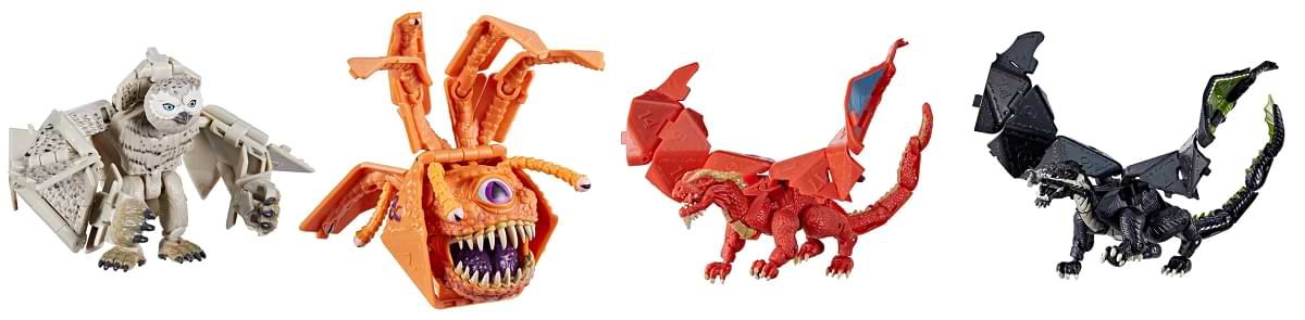 Toys depicting an owlbear, beholder, red dragon, and black dragon